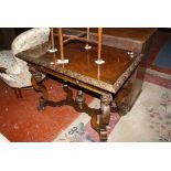 A carved oak and walnut inlaid centre table in the Jacobean style with a single frieze drawer and