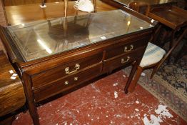 A Chinese hardwood side table with four frieze drawers 117cm wide