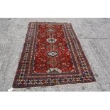 A vintage Caucasian rug 212 x 132cm