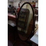 A mahogany cheval mirror with oval plate. 157cm high.