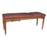 An Edwardian walnut examination/massage table by S. Maw & Sons, circa 1905, with an adjustable