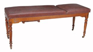 An Edwardian walnut examination/massage table by S. Maw & Sons, circa 1905, with an adjustable