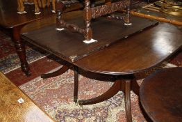 A 19th Century twin pedestal extending mahogany dining table with an additional leaf 215cm extended