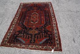 A vintage Persian Koliayi rug 234 x 147cm
