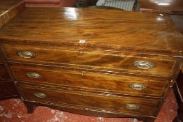 A George IV mahogany veneered commode of three long drawers, 118cm long, 87cm high.