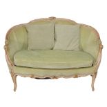 A French Louis XVI style sofa, with carved and curved top rail leading to back and arms, above