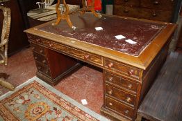 A pine pedestal desk leather lined top with drawers to both pedestals. 158cm x 110cm.