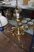 A 17th Century style candelabra with eight scrolling branches 75cm diameter, together with a brass