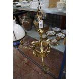 A 17th Century style candelabra with eight scrolling branches 75cm diameter, together with a brass