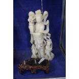 A large carved steatite (soapstone) figure of Guanyin, goddess of mercy, 50cm high with a shaped
