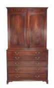A George III mahogany secretaire bookcase  , circa 1780, the moulded cornice above a pair of