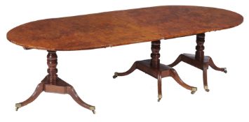 A George IV burr yew triple pillar dining table,   circa 1825, the two D ends in solid yew, the