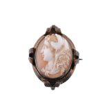 A shell cameo brooch, carved with the profile of Hercules wearing the Nemean lion pelt, within a