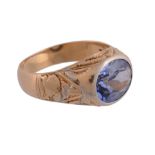 A synthetic sapphire single stone ring, the oval cut synthetic sapphire in a collet setting with