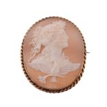 A shell cameo brooch, the oval cameo carved with the profile of Hemera with flowers in her hair,