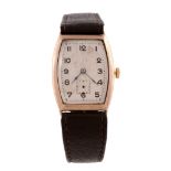 A 9 carat gold tonneau shaped wristwatch, ref. 321482, import mark for Glasgow 1928, Swiss manual