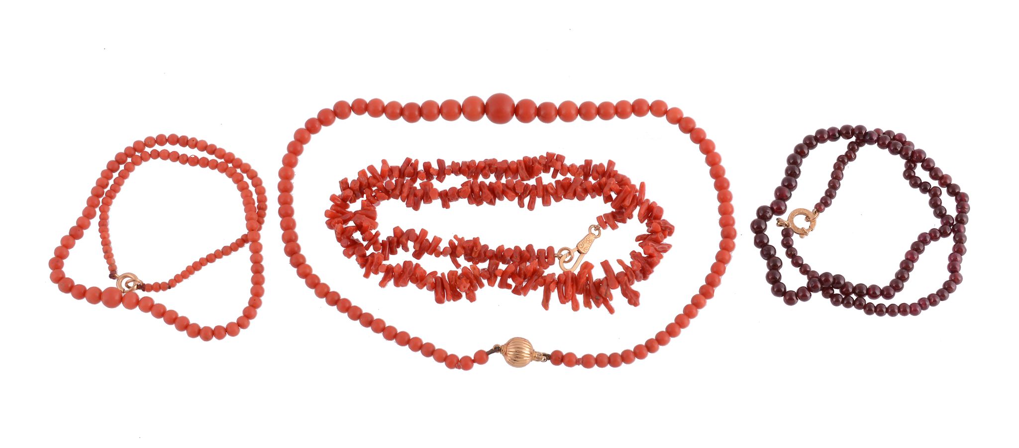 A coral bead necklace, composed of graduating circular shaped coral beads, to a reeded circular