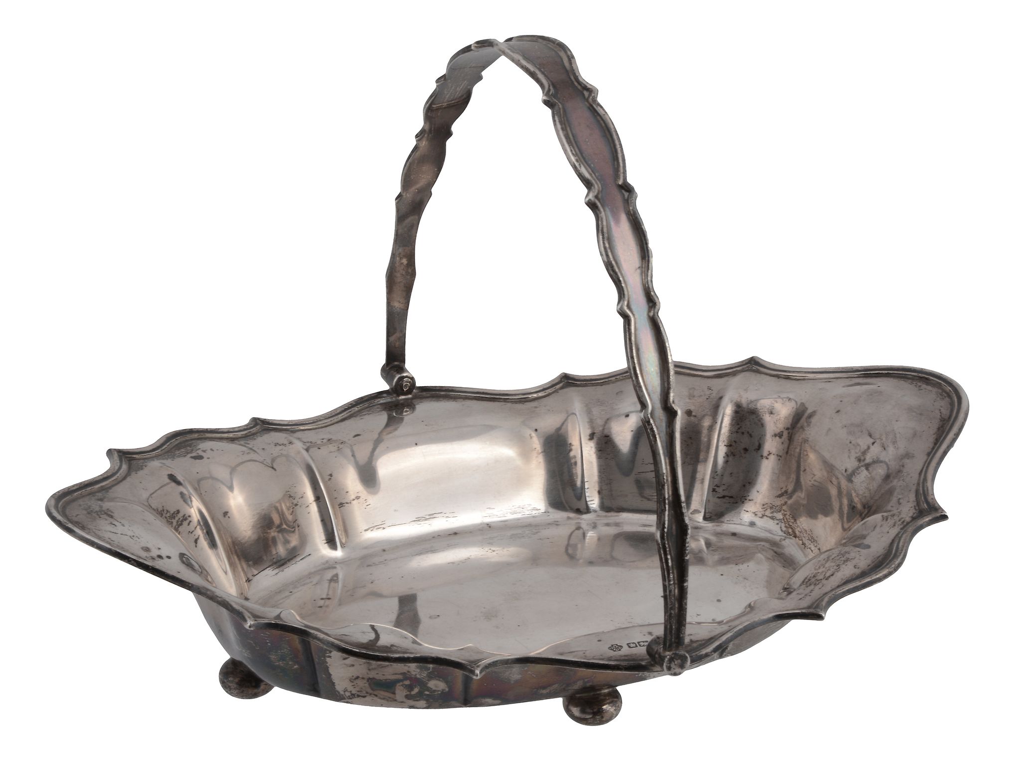 A silver swing handled basket by William Hutton & Sons, Sheffield 1910, with a swing handle, a