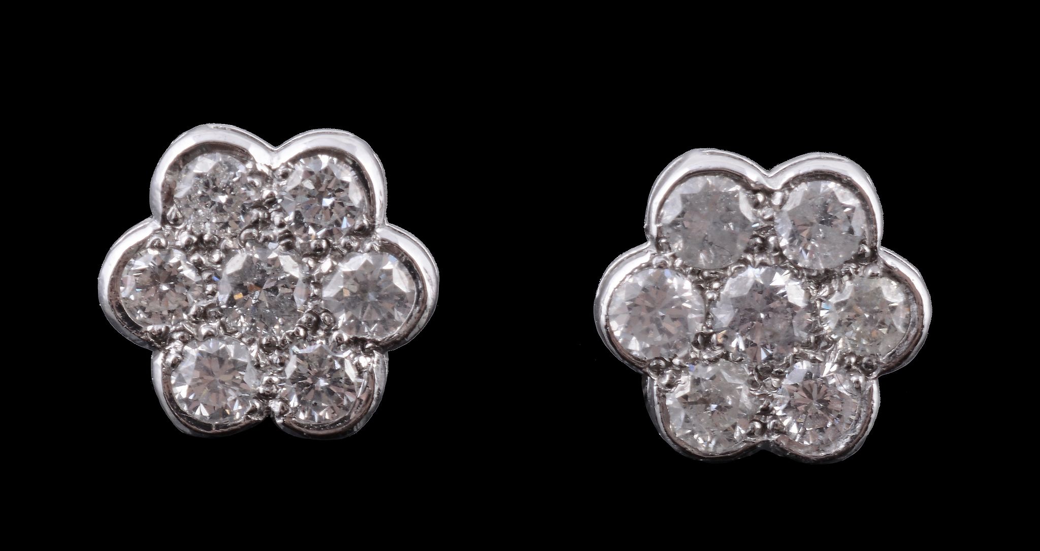 A pair of diamond set cluster ear studs, designed as a flower head, set with brilliant cut