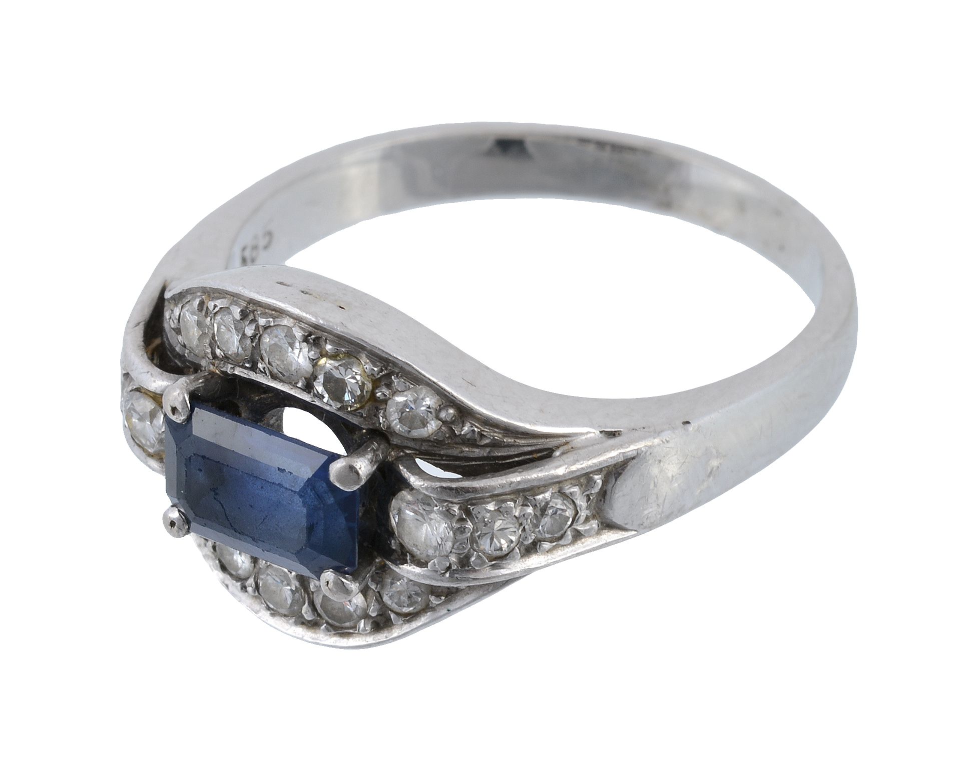 A sapphire and diamond dress ring, the step cut sapphire with canted corners to a pierced diamond - Image 3 of 3