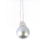 A South Sea cultured pearl and diamond pendant, the black cultured pearl with a brilliant cut