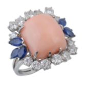 A coral, diamond and sapphire ring, the central cushion shaped coral claw set between marquise