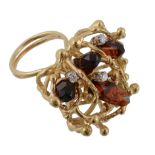 A citrine and diamond ring, the citrine crystals set within an abstract surround accented with