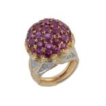 A ruby and diamond bombe ring, centrally set with circular shaped rubies in a domed setting, raised