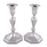 A pair of silver octagonal candlesticks by Hawksworth, Eyre & Co. Ltd, Sheffield 1916, plain, the