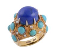 A lapis lazuli, turquoise and diamond set dress ring by Trio , the central cabochon lapis lazuli