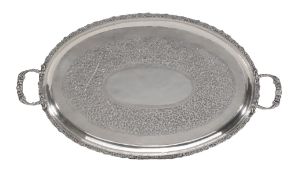 A Cambodian silver coloured shaped oval twin handled tray, stamped T80 and a shield mark, late
