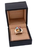 A gem set dress ring by Bulgari, the two colour setting set with a quatrefoil of cabochon gems,