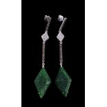 A pair of green hardstone and diamond earrings, the carved marquise shaped panels of green