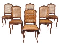 A set of six French walnut and canework dining chairs, late 19th century/early 20th century, each