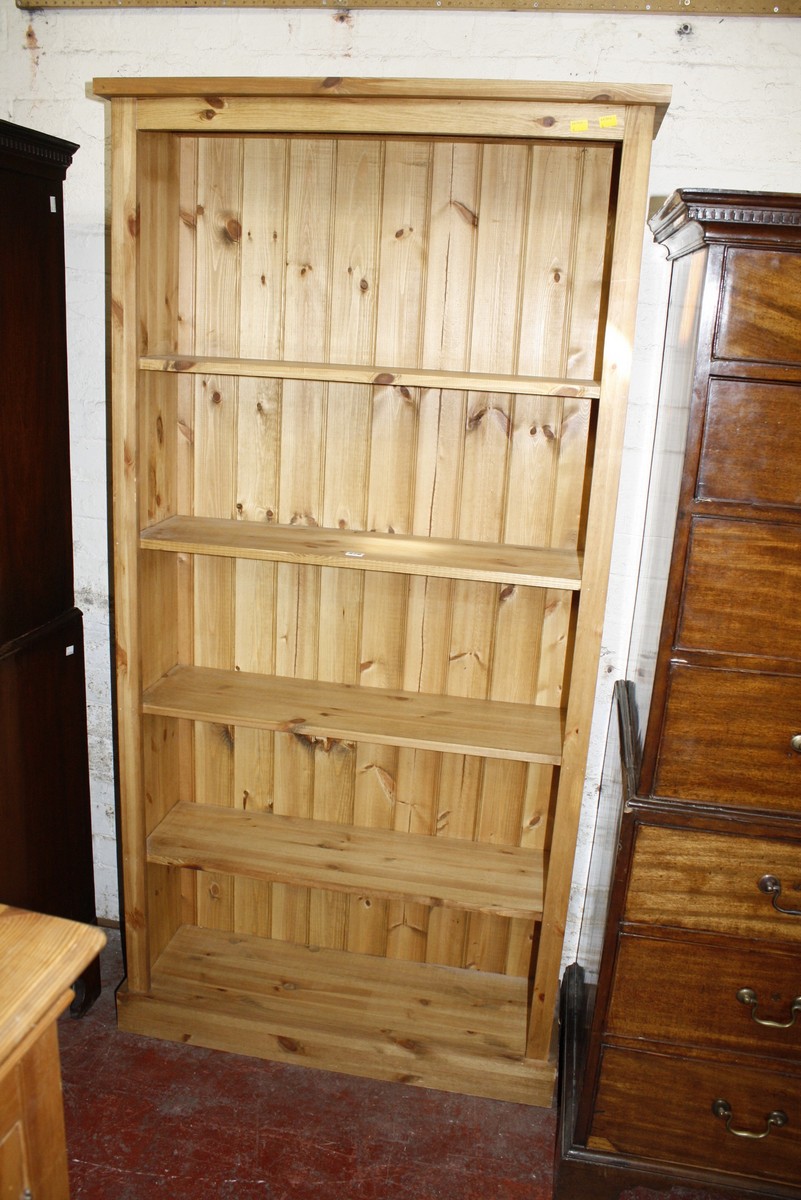 A modern pine bookshelf with adjustable shelves 184cm high, 92cm wide £45-60