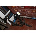 A pair of wrought iron fire dogs  Best Bid