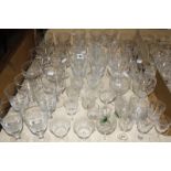 A collection of drinking glasses, some with engraved decoration and some cut glass. £80-120