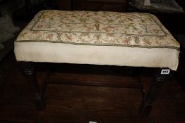 A 19th Century oak stool with earlier crewel work upholstery £80-120