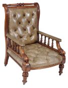 A Victorian mahogany and leather upholstered library chair, circa 1860, with turned top rail above