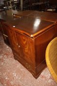 A reproduction mahogany finished TV cabinet and an open bookcase. £60-80