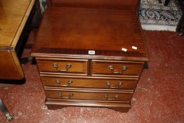 A reproduction mahogany chest of drawers £60-80