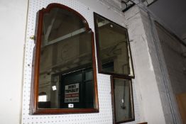 A mahogany framed arch topped wall mirror, late 19th century, plus two further mirrors £60-90