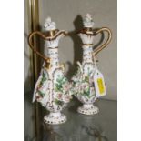 Pair Rockingham style ewers, floral encrusted, (af) 18cm high and German porcelain figure of a
