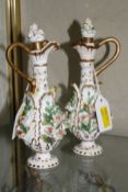 Pair Rockingham style ewers, floral encrusted, (af) 18cm high and German porcelain figure of a