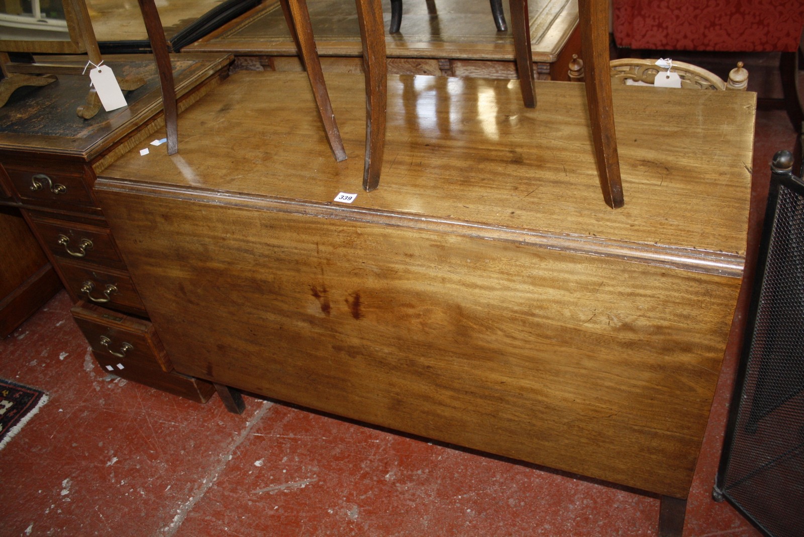 A late George III mahogany drop leaf dining table. £100-200