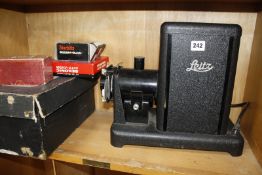 A Leitz slide projector a boxed Kodascope,cased vintage cameras and lenses. £80-120
