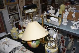 A mixed group of modern table lamps to include, two desk lamps, a pair of crackled glass lamps, a