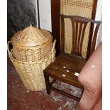 An oak chair with solid seat and a wicker log basket and laundry basket  Best Bid