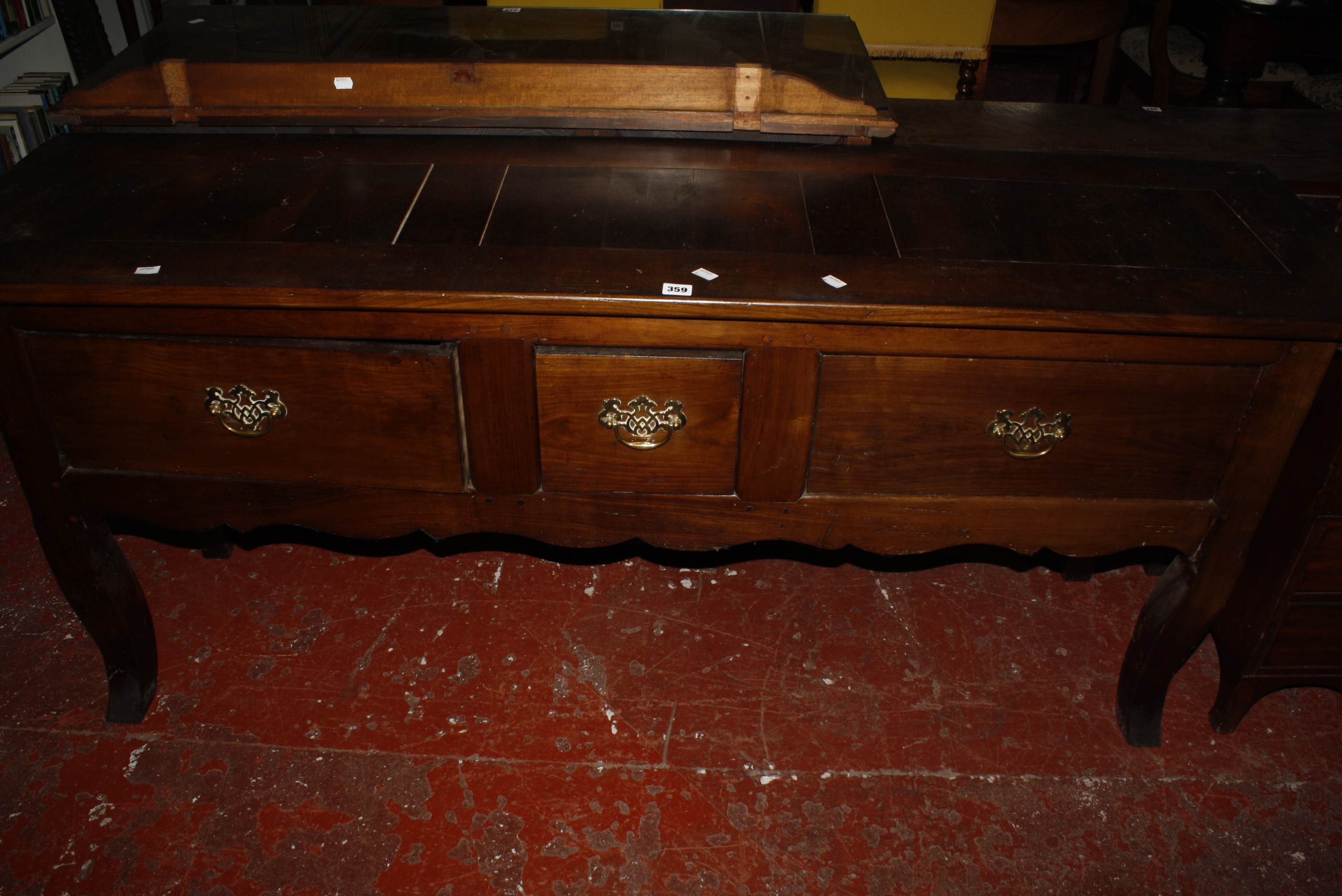 An 18th Century style low dresser with three drawers on shaped legs 176cm wide £120-180