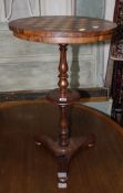 A Regency rosewood chess top table on a slender turned column with triform base. £80-120